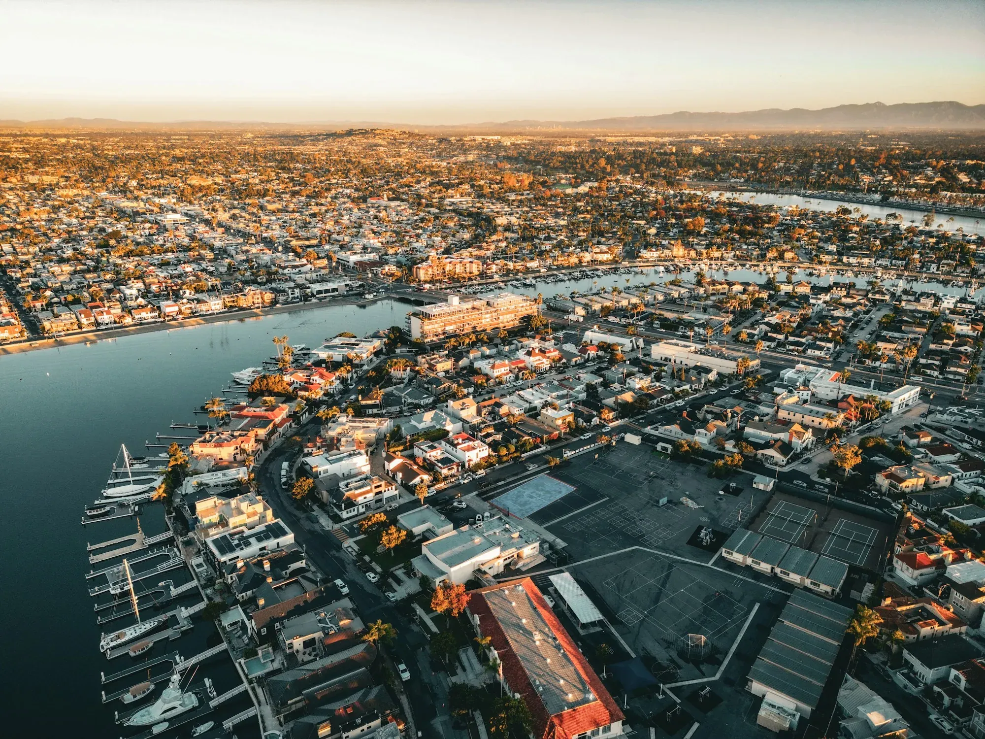 Aerial view of a Southern California coastal town at golden hour